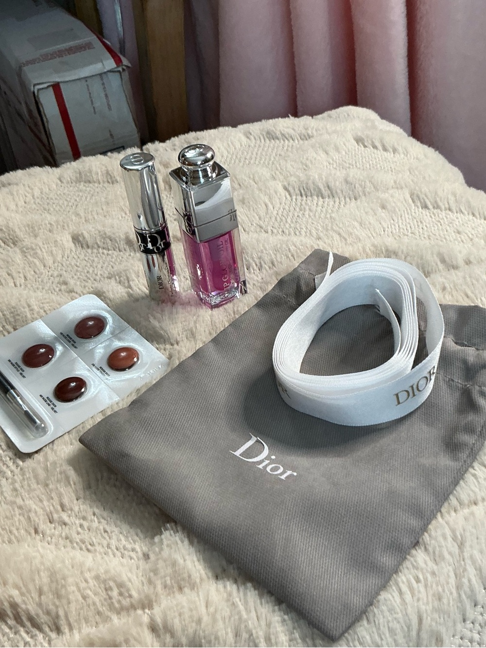 Dior White Logo Ribbon with Gray Pouch and Pink Lip Gloss Accent